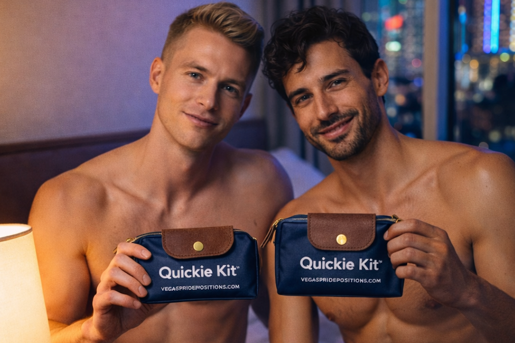 Two shirtless men holding 'Quickie Kit' packages in a room with city lights in the background.